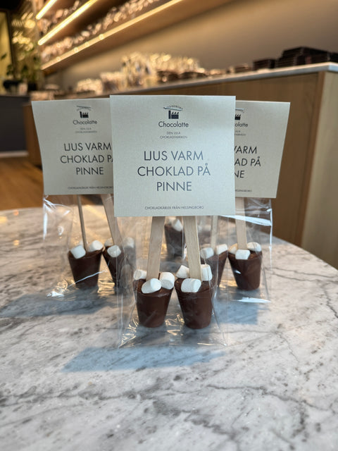 Varm chokolade på pind i mælkechokolade
