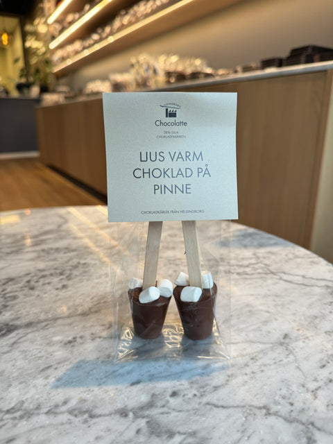 Varm chokolade på pind i mælkechokolade